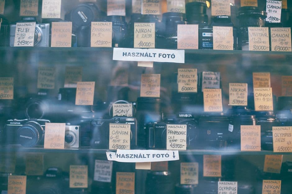 A shop window display of second-hand cameras