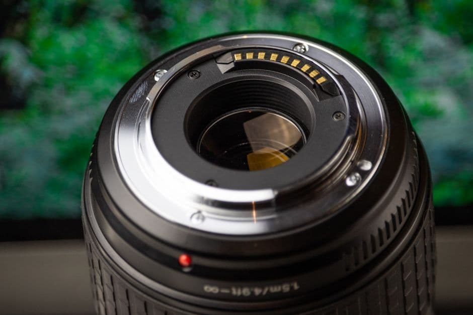 Close-up of a camera lens mount showing the metal contacts