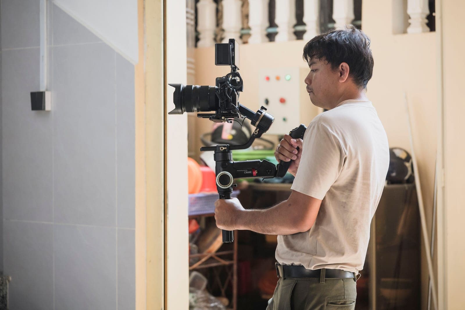 A mirrorless camera mounted on a handheld gimbal stabilizer